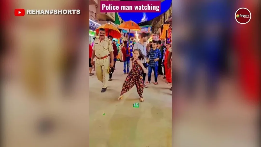 cute girl started dancing middle of the road policemen standing behind people 