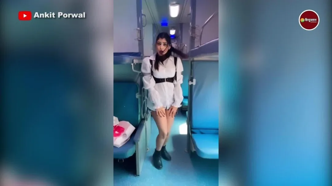 girl dancing in a train wearing a short dress person who came from behind did this act 