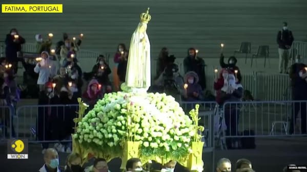 Watch Breaking News Keeping The Faith Thousands Pray In Portugal S Main Catholic Site For End To Pandemic Zee5 Latest News