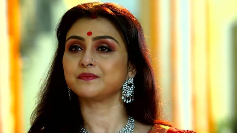 Dadi Gives Offering in the Puja with Jamuna's Help