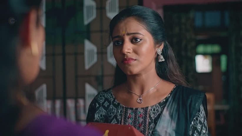 Sujatha Hands Ornaments to Nithya