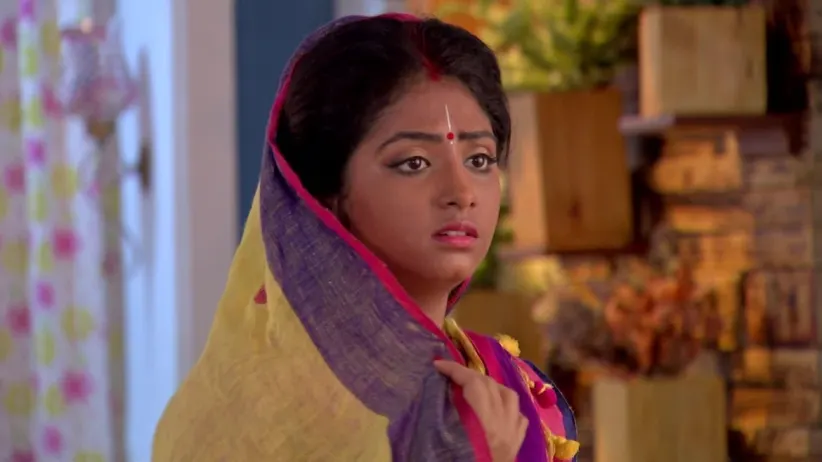 Shyama tends to an injured Nikhil - Krishnakoli