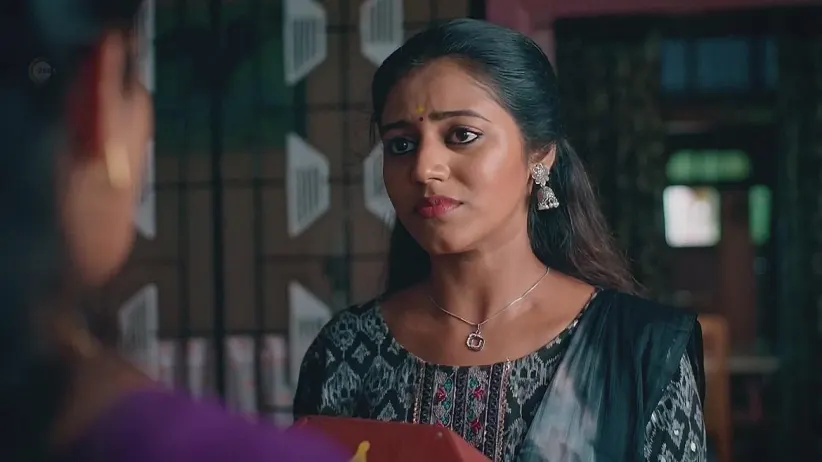 Sujatha Hands Ornaments to Nithya