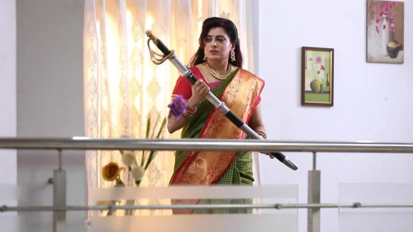 Akhila Worships the Ancestral Sword